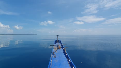 View-from-bow-of-boat-slowly-moving-over-calm-flat-ocean-waters