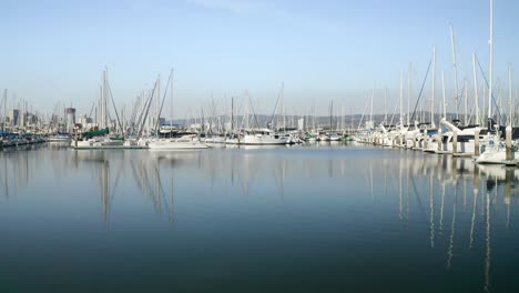 Rising-up-to-meet-the-sunny-day-with-sail-boats-across-glassy-waters