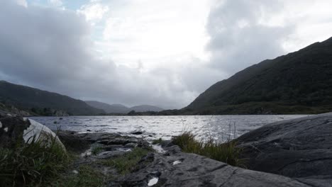 National-Park-Time-Lapse-of-cloudy-sky-and-lake-between-hills,-Ireland