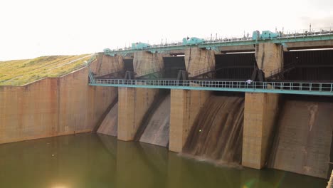 Closeup-of-Opening-gates-or-sluice-of-small-Water-reservoir-or-dam-during-afternoon