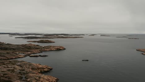Aerial-over-the-rocky-shoreline-near-Lysekil,-Sweden