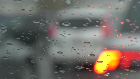 Defocused-cars-in-line-at-border-control,-rainy-weather-conditions,-in-Europe