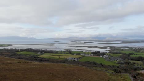 Aerial:-Flying-backwards-above-landscape-of-Clew-Bay-with-many-islands,-Ireland