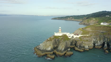Aerial-view-4K,-Baily-Lighthouse,-speed-ramp,-Irish-Coast