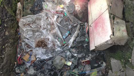 Polluted-and-clogged-sewer-full-of-plastic-trash-with-no-water-flow