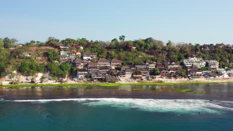 The-surf-spot-of-Bingin-at-the-cliffs-of-Uluwatu-during-a-sunny-day
