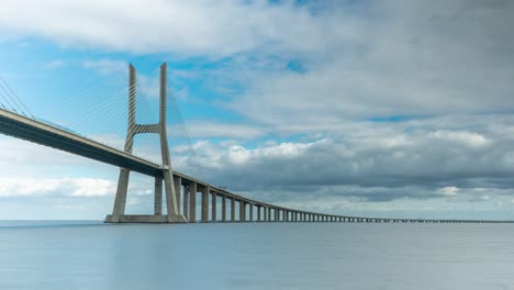 Timelapse-of-the-Vasco-da-Gama-bridge-in-Lisbon,-Portugal-on-a-cloudy-day