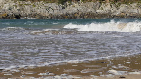 Strong-moving-force-of-flooding-spring-tides-sea-waters,-slow-motion-pan-shot