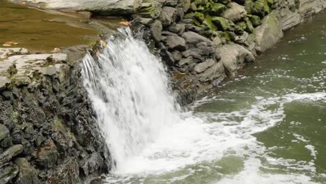 Waterfall-near-Covered-Bridge,-Thomas-Mill-at-the-Wissahickon-Creek