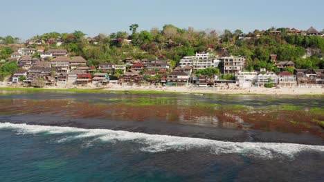 The-surf-spot-of-Bingin-at-the-cliffs-of-Uluwatu-during-a-sunny-day