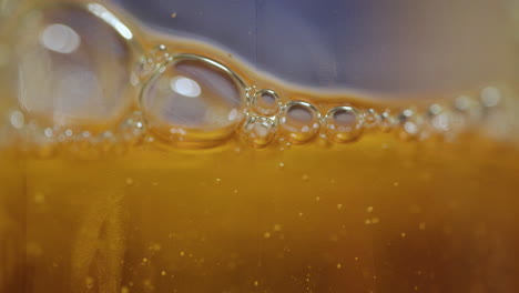 Extreme-macro-close-up-of-abstract,-orange,-viscous-liquid-bubbles