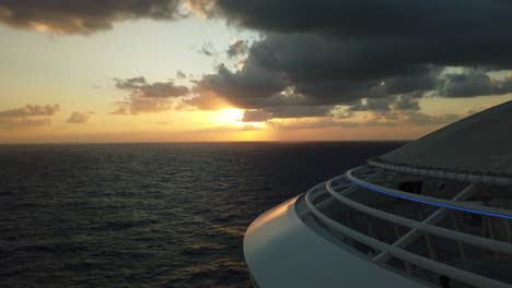 Gorgeous-orange-and-red-sunset-over-the-open-ocean-from-cruise-ship-on-a-voyage-across-the-sea