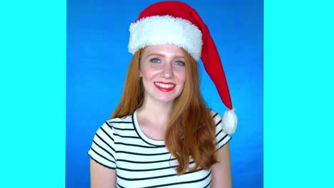 woman-in-santa-hat-smiling-and-looking