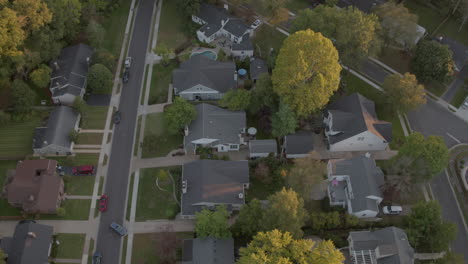aerial-flyover-a-nice-suburban-neighborhood-in-the-midwest-on-a-fall-evening