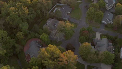 Aerial-view-of-suburban-houses-and-neighborhood-at-sunset