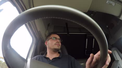 In-cab-action-cam-view-of-a-male-HGV-Driver