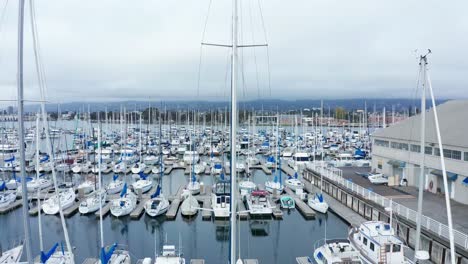 Main-mast-sailboats-passing-by-the-marina-on-a-cloudy-day