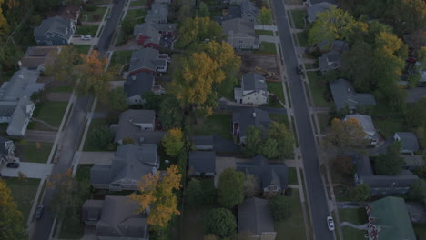 top-down-view-of-suburban-neighborhood-with-a-tilt-up-to-reveal-horizon