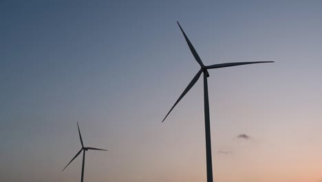 Wind-Turbines-Silhouette-against-the-Blue-sky-during-Sunset,-clean-alternative-energy-in-Thailand-and-mainland-Southeast-Asia