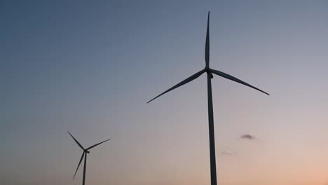 Wind-Turbines-Silhouette-against-the-Blue-sky-during-Sunset,-clean-alternative-energy-in-Thailand-and-mainland-Southeast-Asia
