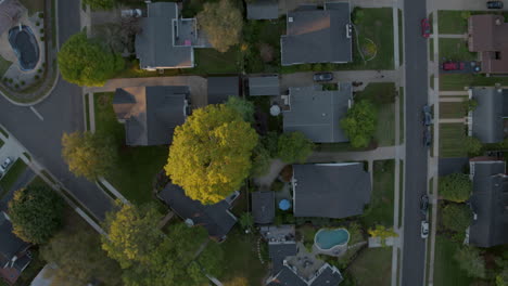 Top-down-view-of-suburban-neighborhood-houses-streets-and-cars