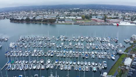 Huge-marina-full-of-sailboats-and-equipment-on-a-sunny-cloudy-day