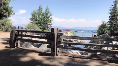 A-fence-with-trees-and-Lake-Tahoe-beyond