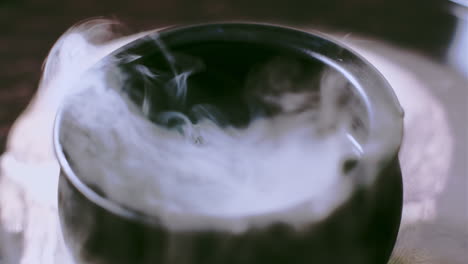 Witch's-Cauldron-bubbling-with-green-potion-in-a-spooky-halloween-scene