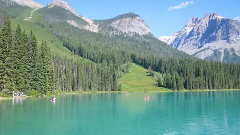 summer-clear-blue-lake-view-Emerald-Lake-with-people-canoeing-in-lake-and-beautiful-mountain-range-with-clear-blue-sky-in-summer-holiday-in-yoho-banff-national-park,Alberta,Canada