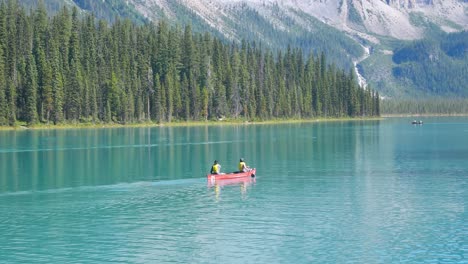 summer-clear-blue-lake-view-with-people-canoeing-in-lake-and-beautiful-mountain-range-with-clear-blue-sky-in-summer-holiday-in-yoho-banff-national-park,Alberta,Canada