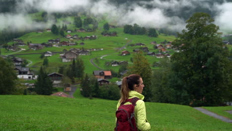Woman-backpacker-hikes-into-the-Swiss-alpine-village-of-Wengen