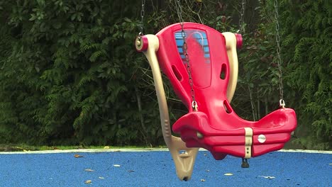 EMPTY-TODDLER-KID-SWING-AT-A-PLAYGROUND