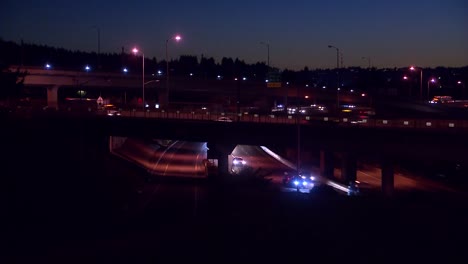 CARS-ON-BRIDGES-DRIVING-OVER-FREEWAY-AT-NIGHT
