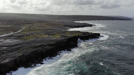 Aerial:-Flying-backwards-with-panoramic-view-of-rugged-irish-coastline