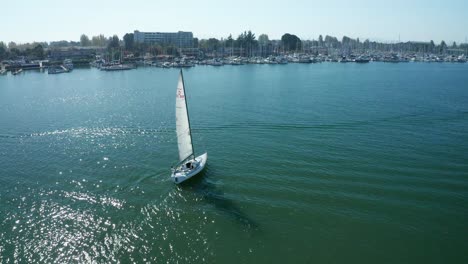 A-nice-pass-and-pan-down-over-the-sailboat-in-the-marina-on-a-sunny-day