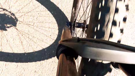 A-view-of-a-bicycle-wheel-as-it-spins-on-the-road