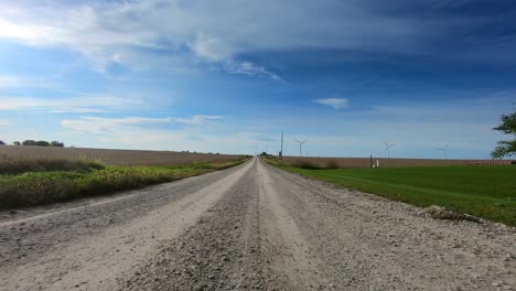 Double-time,-point-of-view-footage-while-driving-down-a-gravel-road-in-rural-Iowa