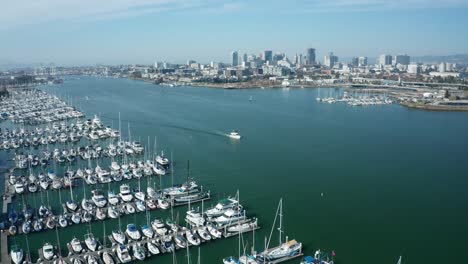 A-very-large-estuary-with-a-marina-and-hundreds-of-sailboats-on-a-sunny-day-in-the-bay