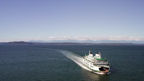 Aerial-Flyover-of-the-Seattle-Car-Ferry-with-Bainbridge-Island-in-the-Background