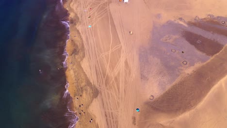 Gran-canaria-beach-flight-in-clear-blue-sky-aerial-drone-flying-over-dunes-at-las-palmas-beach-in-canaries-islands