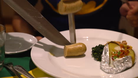 slicing-steak-brazillian-style-on-plate