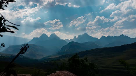 4K-time-lapse-of-sun-shining-through-the-clouds-at-Drakensberg's-majestic,-Cathedral-Peak-Mountain-in-South-Africa