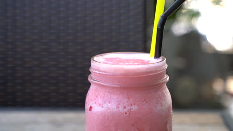 jar-of-strawberry-smoothie-in-cafe