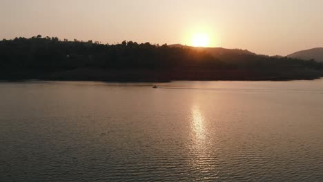Lonavla-lake-drone-fallows-motor-bike-in-sunset-4k-cinematic