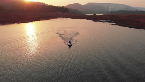 Lonavla-lake-drone-fallows-motor-bike-in-sunset-4k-cinematic