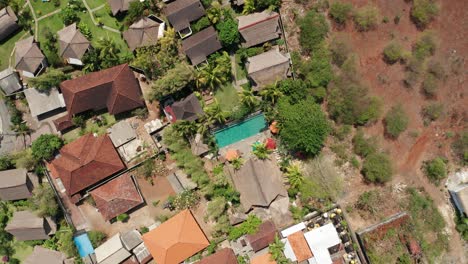 Bungalows,-Villas-and-Swimming-Pool-on-Bali-Island-Indonesia,-Top-Down-Ascending-Aerial