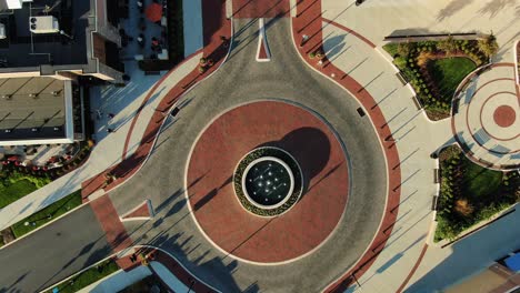Decorative-high-end-traffic-circle-roundabout-with-no-cars,-aerial-drone-birds-eye-view