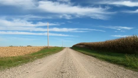 Point-of-view-footage-while-driving-down-a-gravel-road-in-rural-Iowa