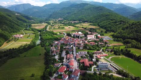 Drone-shot-of-Ponte-San-Quirino,-Italy,-surrounded-by-mountains
