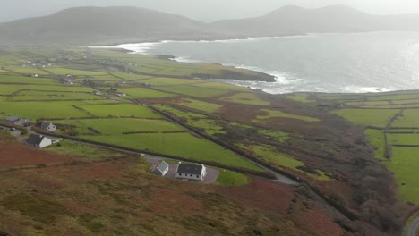 Reveal-shot-of-irish-landscape-with-beautiful-coastline-in-background